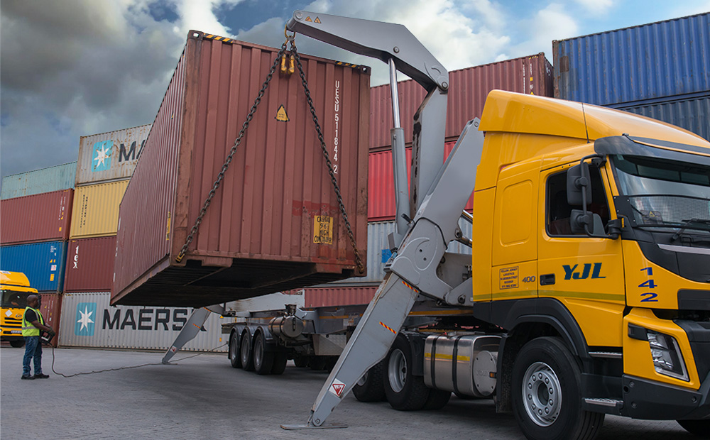 Side Loader operation demonstrating safe loading and unloading of containers.
